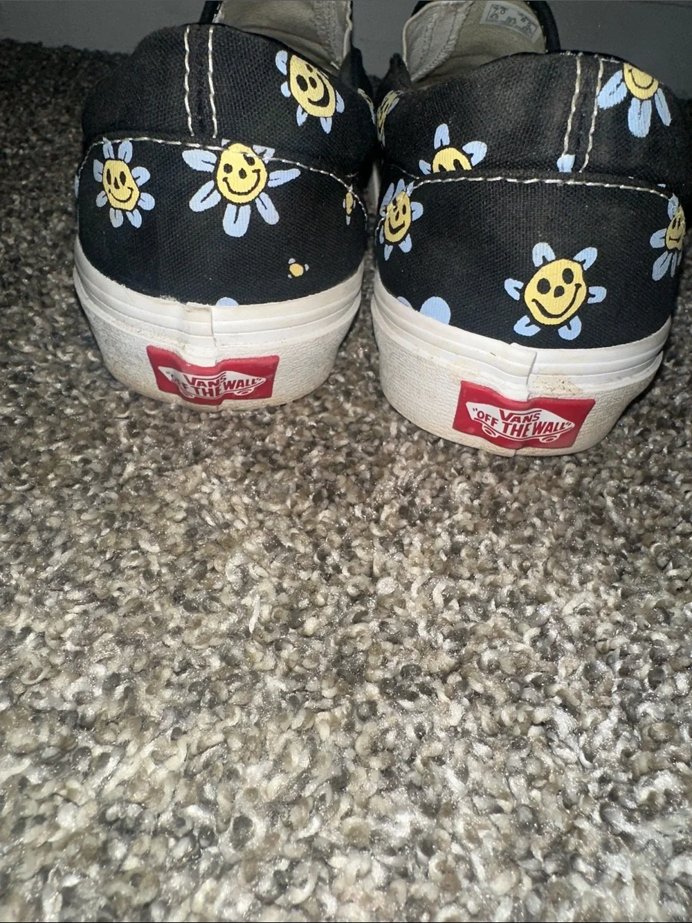 Vans Black Slip-On Sneakers with Yellow & Light Blue Daisy Smiley Print